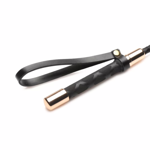 Master Series Riding Crop with a textured black handle and rose gold accents