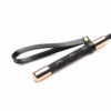 Master Series Riding Crop with a textured black handle and rose gold tip