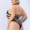 Model wearing a black Baci Halter Top Wetlook Teddy with cutouts