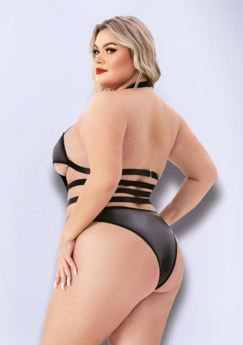 Model wearing a black Baci Halter Top Wetlook Teddy with cutouts