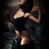 This striking image captures the essence of bold femininity. A woman in black lingerie poses on a bed