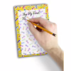 Add a touch of humor to your notes with the Little Genie Super Fun Penis Notepad. Hand writing on a colorful penis-themed notepad