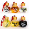 Colorful drink containers labeled 'Drink Me,', in festive ball shapes