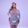 Off-the-shoulder glow in the dark lace mini dress on a model