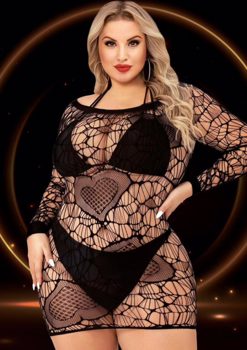 A model wearing a sheer black lace long sleeve mini dress with heart patterns