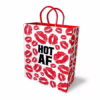 Spice up your gifting with the Little Genie HOT AF Gift Bag! Vibrant gift bag with red lip prints and 'HOT AF' text