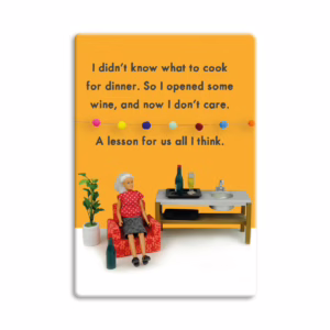 Enjoy a lighthearted moment with this fun fridge magnet that brings a smile to your kitchen. Whimsical fridge magnet with a doll on a red chair, wine bottles, and text; available at The Loving Company.