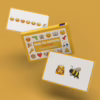 Get ready for fun with the 'Name The Emoticon' card game, perfect for emoji lovers! The 'Name The Emoticon' card game by Bubblegum Stuff, with emoji cards on a yellow backgr