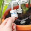 Enhance your plant care routine with this innovative life support system. A hand holds a valve connected to a tube for plant life support