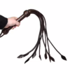 Prowler Red Brown Leather Flogger in a hand, with braided handle and long tails