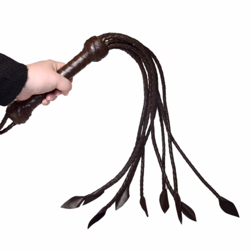 Prowler Red Brown Leather Flogger in a hand, with braided handle and long tails