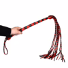 Prowler Red Long Handle Flogger in black and red, held in a hand