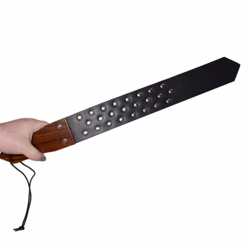 Prowler Red Leather and Wood Studded Paddle in hand