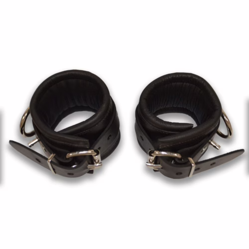 Lockable black leather ankle restraints with padded interior