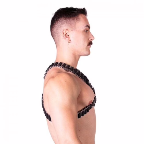 A model wearing a black and silver Prowler Red Ballistic Harness