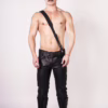 Model wearing a black leather outfit with a Sam Browne Belt