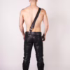 Model from back wearing Prowler Red Sam Browne Belt - Black, black leather pants and boots