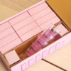 Bubblegum Stuff Tipple Topple Tower Party Game, featuring pink blocks and shot glasses