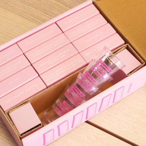 Bubblegum Stuff Tipple Topple Tower Party Game, featuring pink blocks and shot glasses