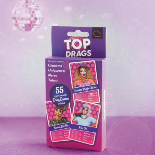 Celebrate your favorite drag queens with the Top Drags card game, available at The Loving Company. Bubblegum Stuff Top Drags Card Game box with drag queens' images and stats