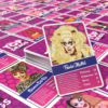 Discover the fabulous world of drag with the 'Top Drags' card game, available now! Colorful 'Top Drags' card game cards featuring characters like Trixie Mattel and Bianca Del Rio, available at The Loving C...