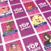 Get ready to play the 'Top Drags' card game and celebrate the art of drag! Colorful 'Top Drags' card game featuring drag queens' cards