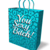 Elevate your gift-giving with this fun and stylish gift bag! Vibrant turquoise gift bag with leopard print and 'You Sexy Bitch!' text