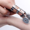 Master series double finger pinwheel sensation play device with dual spiked wheels